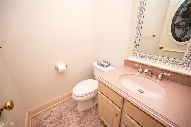4219 Olde Charted Trl, Poland, OH 44514 - half bath featuring toilet, vanity, and baseboards