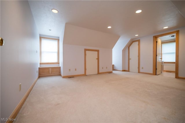 4219 Olde Charted Trl, Poland, OH 44514 - additional living space with recessed lighting, baseboards, light colored carpet, and vaulted ceiling