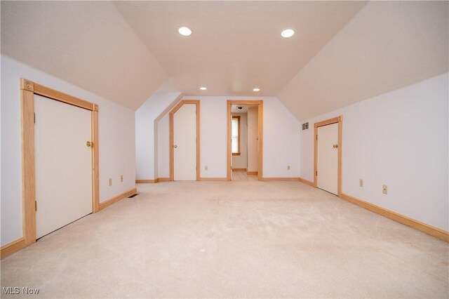 4219 Olde Charted Trl, Poland, OH 44514 - additional living space featuring lofted ceiling, light colored carpet, recessed lighting, and baseboards