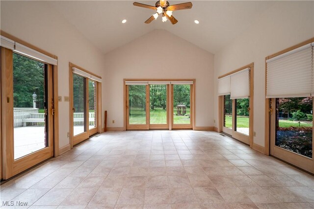 4219 Olde Charted Trl, Poland, OH 44514 - empty room featuring high vaulted ceiling, ceiling fan, baseboards, recessed lighting, and light tile patterned floors