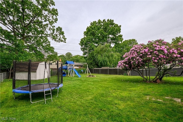 488 Spaulding Dr, Kent, OH 44240 - view of yard featuring a trampoline and a playground
