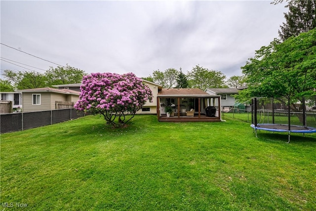 488 Spaulding Dr, Kent, OH 44240 - view of yard with a trampoline and a deck