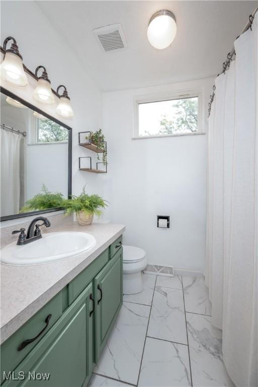 488 Spaulding Dr, Kent, OH 44240 - bathroom featuring vanity, toilet, and marble look tile flooring