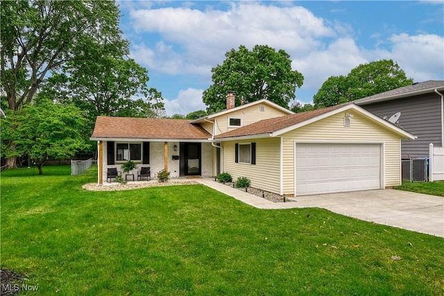 488 Spaulding Dr, Kent, OH 44240 - view of front facade with a garage, a porch, and driveway
