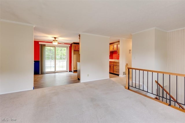 4285 Baird Rd, Stow, OH 44224 - unfurnished room featuring crown molding, light colored carpet, ceiling fan, and baseboards