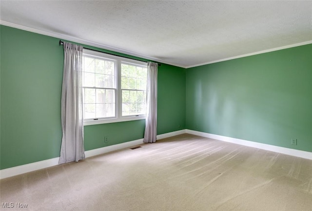 4285 Baird Rd, Stow, OH 44224 - unfurnished room featuring crown molding, a textured ceiling, baseboards, and carpet flooring