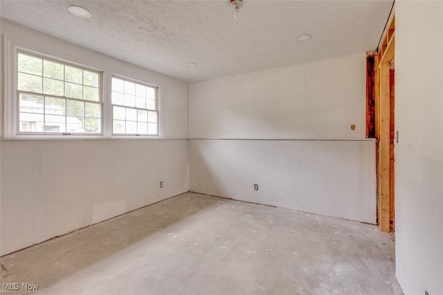 4285 Baird Rd, Stow, OH 44224 - spare room with concrete flooring and a textured ceiling