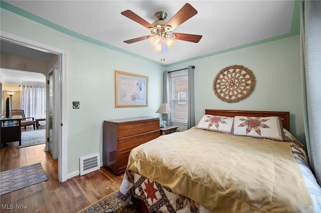 14300 Bidwell Ave, Cleveland, OH 44111 - bedroom featuring wood finished floors, baseboards, and ceiling fan