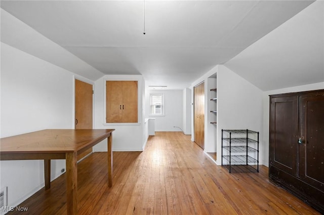 14300 Bidwell Ave, Cleveland, OH 44111 - hallway with light wood-style floors, built in features, and baseboards