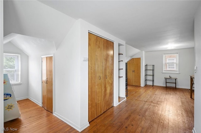 14300 Bidwell Ave, Cleveland, OH 44111 - bonus room featuring light wood-style floors, healthy amount of natural light, lofted ceiling, and baseboards
