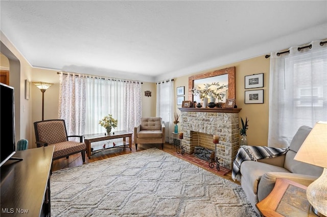 14300 Bidwell Ave, Cleveland, OH 44111 - living area with wood finished floors and a stone fireplace