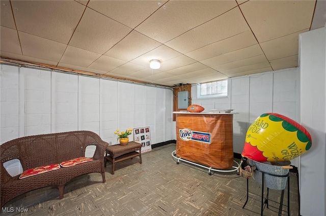 14300 Bidwell Ave, Cleveland, OH 44111 - basement featuring electric panel and a paneled ceiling