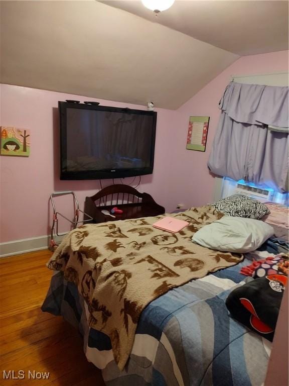 1028 Kenilworth Ave, Coshocton, OH 43812 - bedroom with wood finished floors, vaulted ceiling, and baseboards