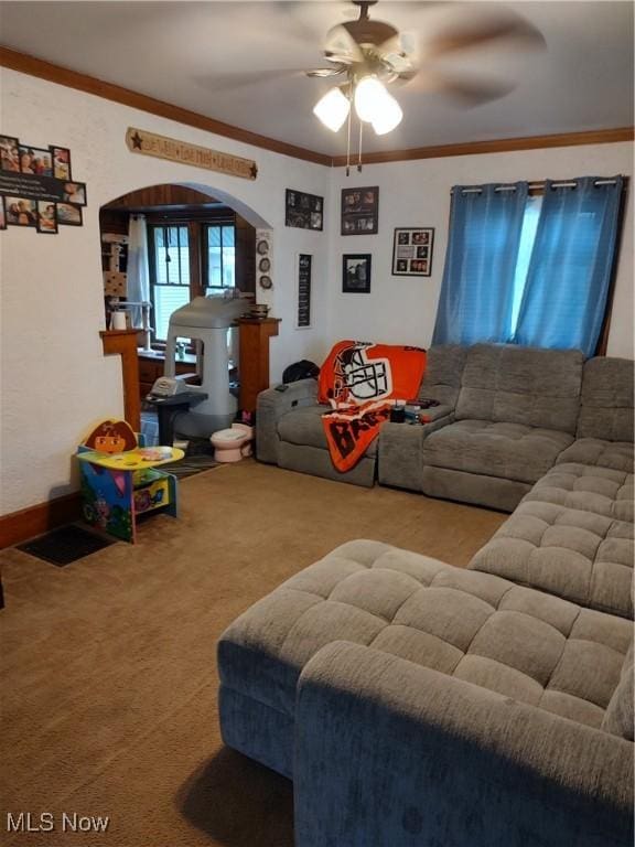 1028 Kenilworth Ave, Coshocton, OH 43812 - living area featuring arched walkways, carpet floors, ceiling fan, and ornamental molding