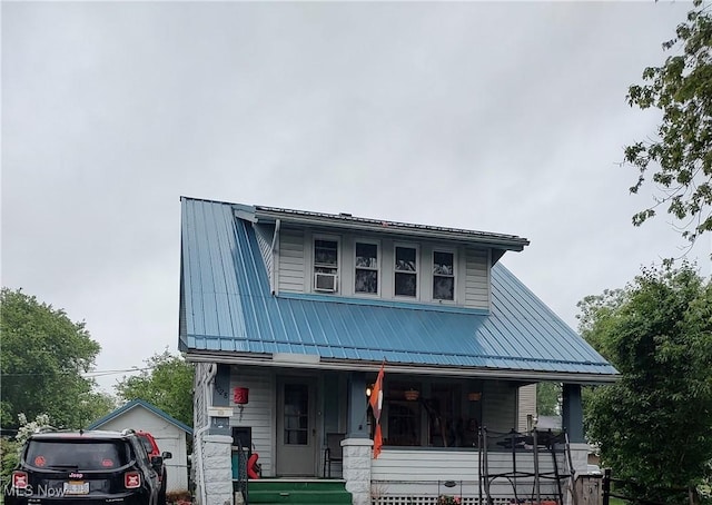 1028 Kenilworth Ave, Coshocton, OH 43812 - view of front facade with a porch and metal roof