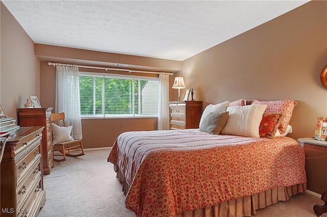 186 Court Dr Unit 201, Fairlawn, OH 44333 - bedroom with light colored carpet, baseboards, and a textured ceiling