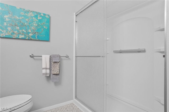 186 Court Dr Unit 201, Fairlawn, OH 44333 - full bathroom with a shower stall, toilet, and baseboards