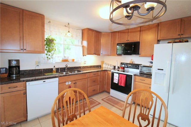 6478 State Rd Unit G8, Parma, OH 44134 - kitchen featuring white appliances, a sink, a chandelier, light tile patterned flooring, and dark stone countertops