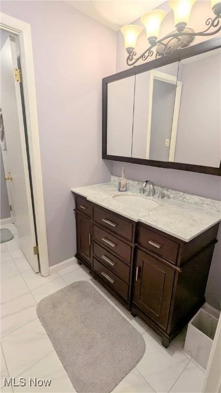 6478 State Rd Unit G8, Parma, OH 44134 - bathroom featuring vanity, marble look tiles, and baseboards