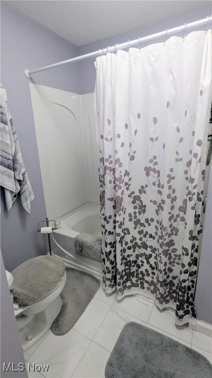 6478 State Rd Unit G8, Parma, OH 44134 - full bathroom with shower / tub combo with curtain, toilet, and tile patterned floors