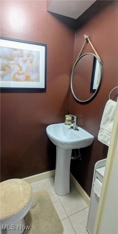 6478 State Rd Unit G8, Parma, OH 44134 - bathroom featuring baseboards and tile patterned flooring