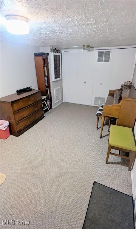 6478 State Rd Unit G8, Parma, OH 44134 - living area with carpet floors and a textured ceiling