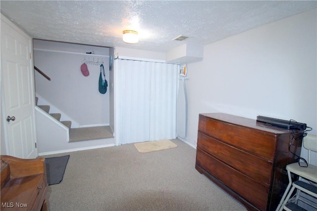 6478 State Rd Unit G8, Parma, OH 44134 - finished below grade area featuring a textured ceiling, carpet flooring, stairway, and baseboards