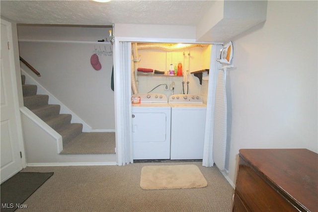 6478 State Rd Unit G8, Parma, OH 44134 - laundry room with carpet flooring, washing machine and clothes dryer, baseboards, and a textured ceiling