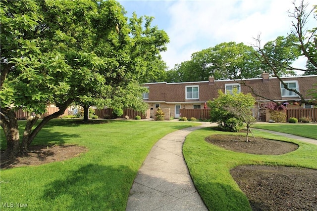 6478 State Rd Unit G8, Parma, OH 44134 - view of front facade with mansard roof, brick siding, and roof with shingles