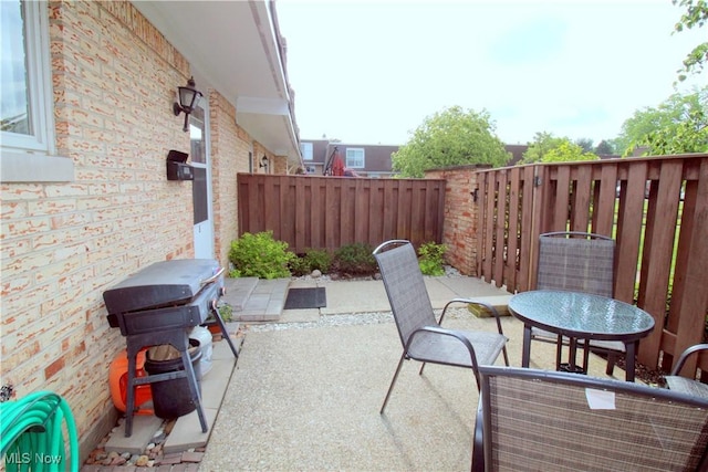 6478 State Rd Unit G8, Parma, OH 44134 - fenced backyard with a patio and outdoor dining space
