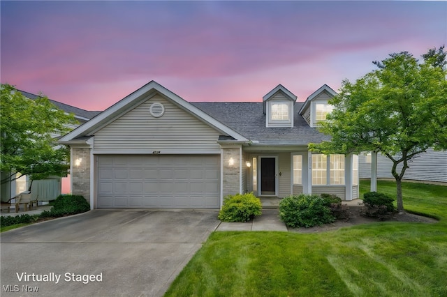 2716 Edgebrook Xing, Twinsburg, OH 44087 - view of front facade featuring driveway, a garage, a lawn, and brick siding