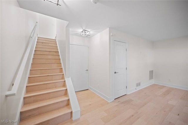 1257 W 75th St Unit D1257, Cleveland, OH 44102 - staircase featuring wood finished floors and baseboards
