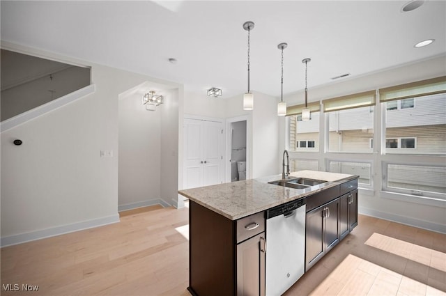 1257 W 75th St Unit D1257, Cleveland, OH 44102 - kitchen with dishwasher, a sink, baseboards, decorative light fixtures, and light wood finished floors