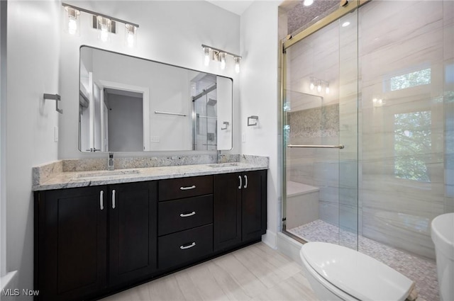 1257 W 75th St Unit D1257, Cleveland, OH 44102 - full bathroom featuring a stall shower, double vanity, and toilet