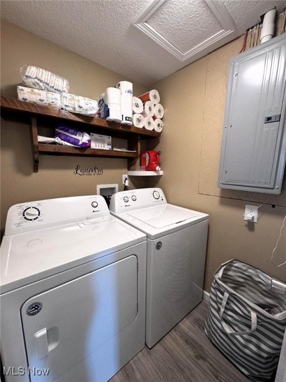 2187 State Route 550, Cutler, OH 45724 - laundry area with electric panel, separate washer and dryer, attic access, wood finished floors, and a textured ceiling