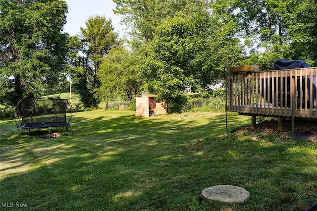 2187 State Route 550, Cutler, OH 45724 - view of grassy yard featuring a trampoline and a wooden deck