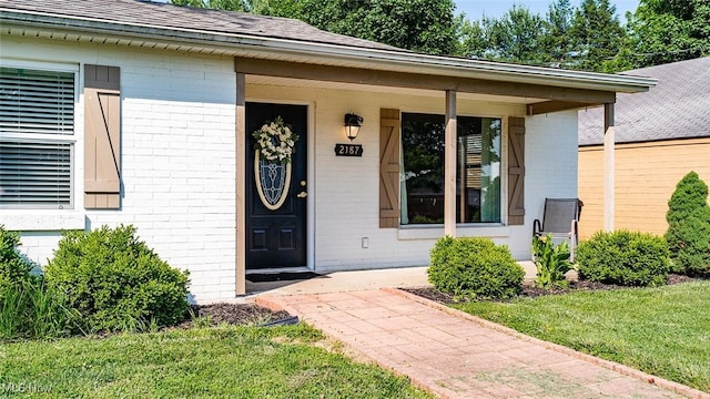 2187 State Route 550, Cutler, OH 45724 - entrance to property featuring brick siding, roof with shingles, and a porch