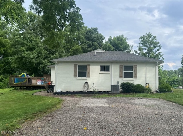 2187 State Route 550, Cutler, OH 45724 - view of front of property with a front lawn, a deck, brick siding, and roof with shingles