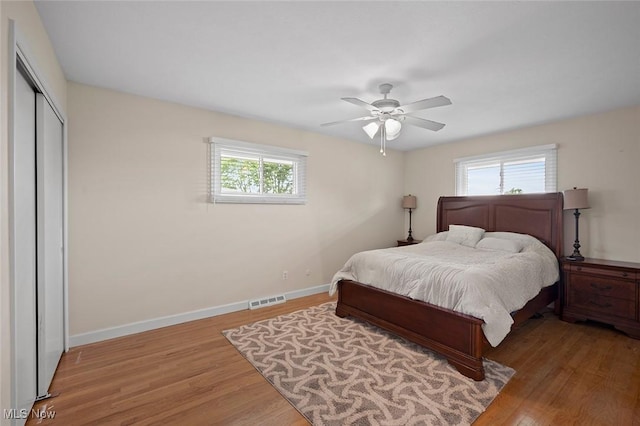 7278 Barton Hill Dr, Parma, OH 44129 - bedroom featuring baseboards, wood finished floors, a closet, and ceiling fan