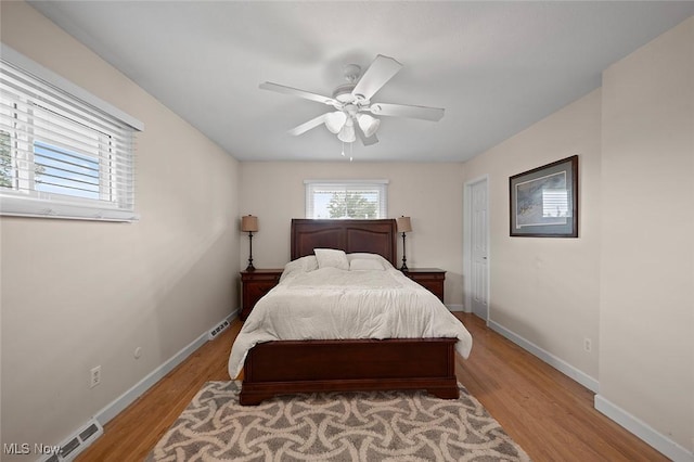 7278 Barton Hill Dr, Parma, OH 44129 - bedroom with light wood-style floors, baseboards, and ceiling fan