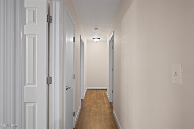 7278 Barton Hill Dr, Parma, OH 44129 - hall with dark wood finished floors and baseboards