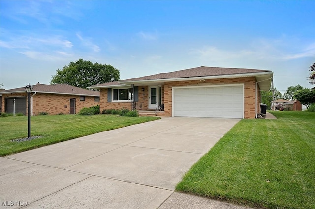 7278 Barton Hill Dr, Parma, OH 44129 - single story home featuring an attached garage, a front yard, driveway, and brick siding