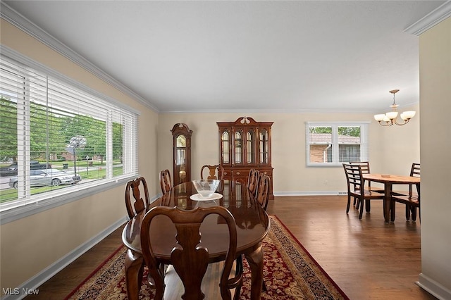 7278 Barton Hill Dr, Parma, OH 44129 - dining area with a chandelier, ornamental molding, wood finished floors, and baseboards