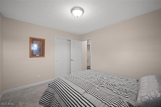 7278 Barton Hill Dr, Parma, OH 44129 - bedroom featuring carpet flooring, a closet, and baseboards