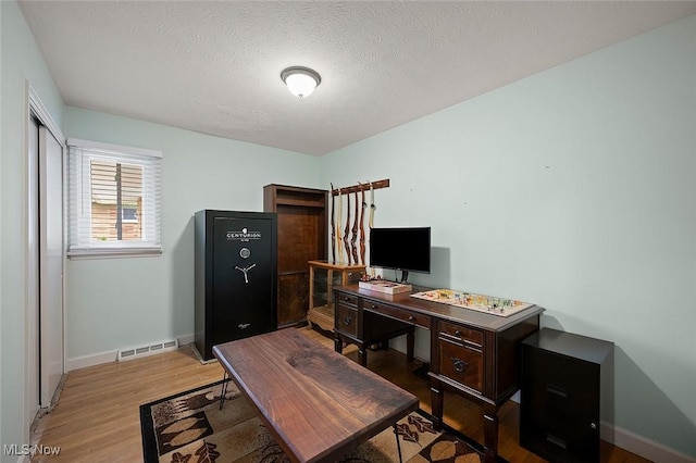 7278 Barton Hill Dr, Parma, OH 44129 - office space featuring light wood-style floors, baseboards, and a textured ceiling