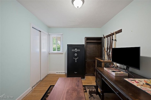 7278 Barton Hill Dr, Parma, OH 44129 - office with wood finished floors, baseboards, and a textured ceiling