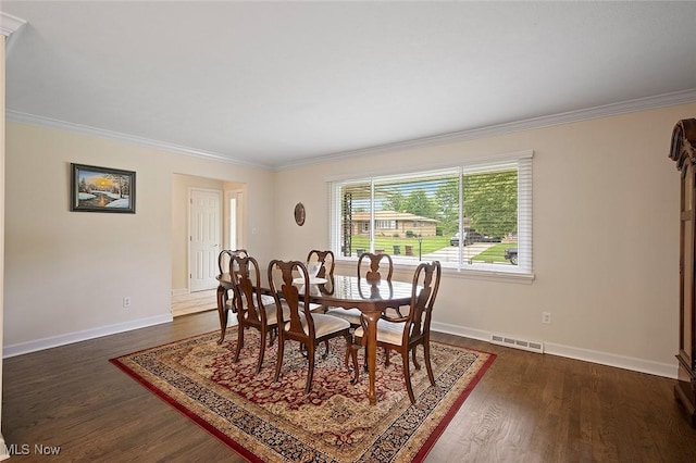 7278 Barton Hill Dr, Parma, OH 44129 - dining space with ornamental molding, dark wood-type flooring, and baseboards