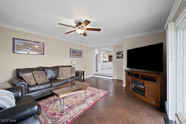 7278 Barton Hill Dr, Parma, OH 44129 - living room featuring ceiling fan, dark wood-style flooring, ornamental molding, and baseboards