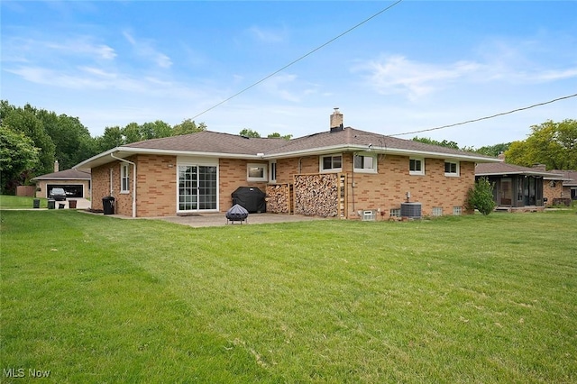 7278 Barton Hill Dr, Parma, OH 44129 - rear view of property featuring a yard, brick siding, a chimney, and cooling unit