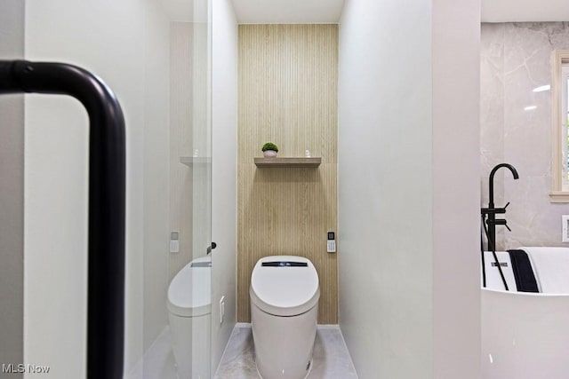 21262 S Woodland Rd, Shaker Heights, OH 44122 - bathroom featuring toilet and baseboards